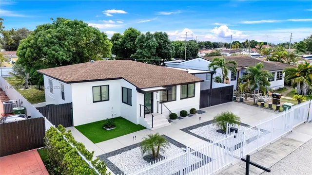 a aerial view of a house with a yard