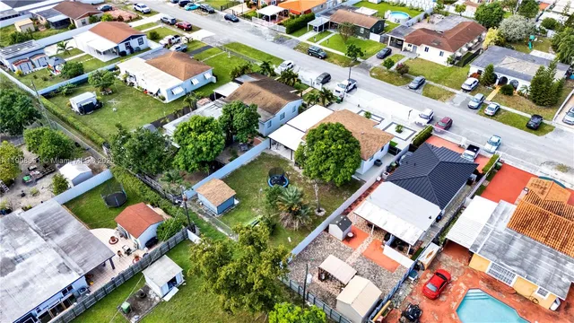 an aerial view of residential house with outdoor space and street view