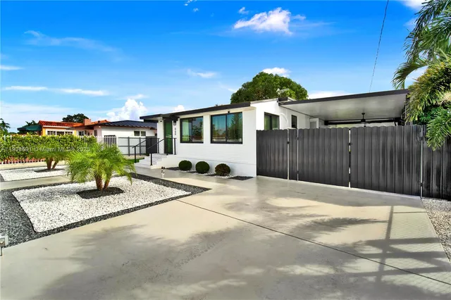 a house view with a backyard space
