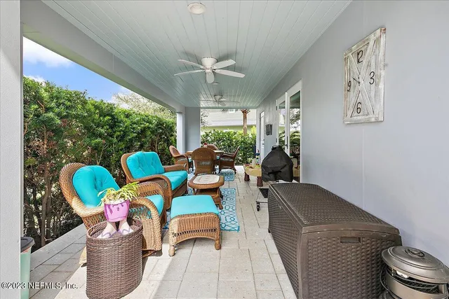 a outdoor dining space with furniture and a potted plant