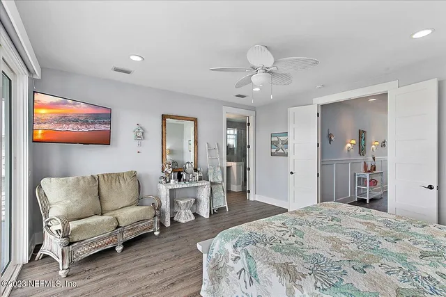 a large bathroom with a granite countertop double vanity sink and a large mirror