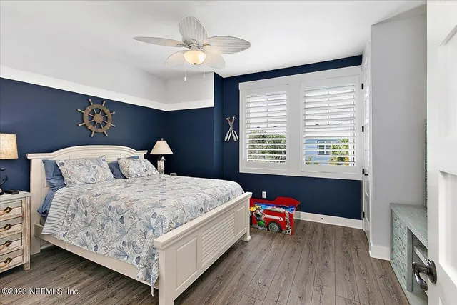 a living room with fireplace furniture and a window