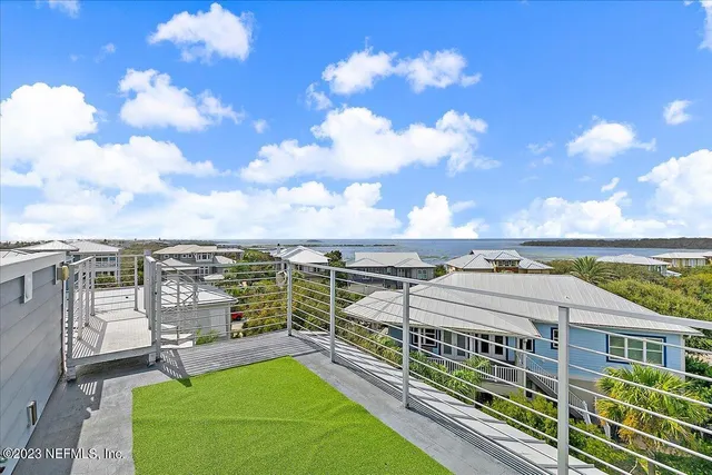 a kitchen with stainless steel appliances granite countertop a sink a stove and a wooden floors
