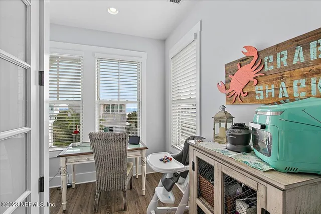 a living room with lots of furniture and a chandelier