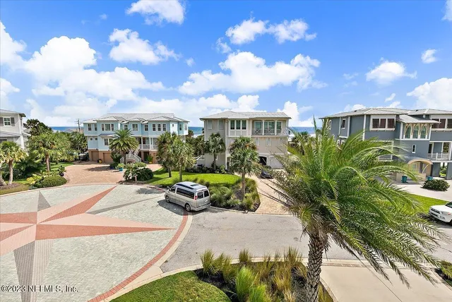 an aerial view of a house with ocean view