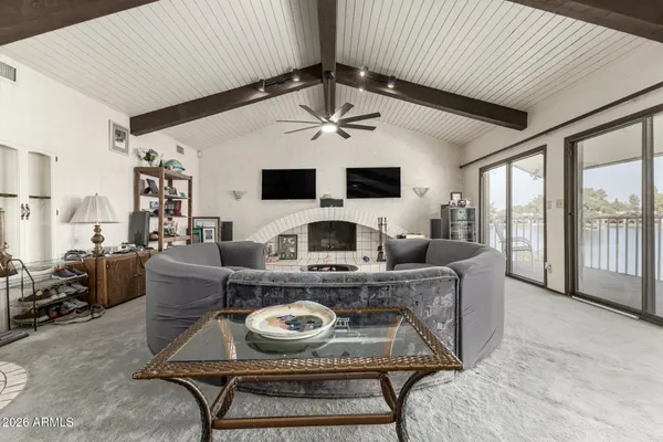 a kitchen with stainless steel appliances kitchen island granite countertop a refrigerator and a sink