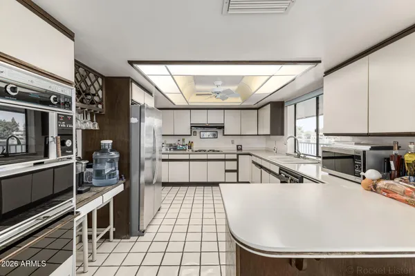 a dining room with furniture and window