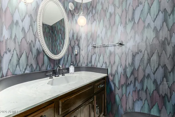 a living room with a bed furniture and a large window