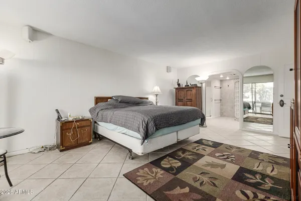 a bathroom with a shower sink and mirror