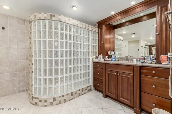 a spacious bedroom with a bed and a window