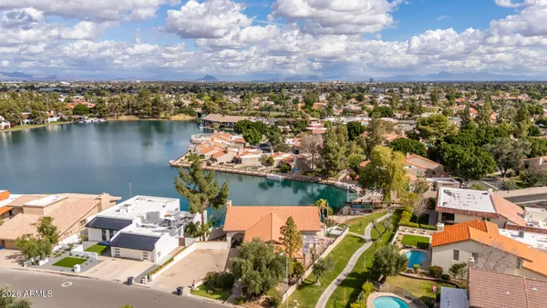 an aerial view of residential houses with outdoor space