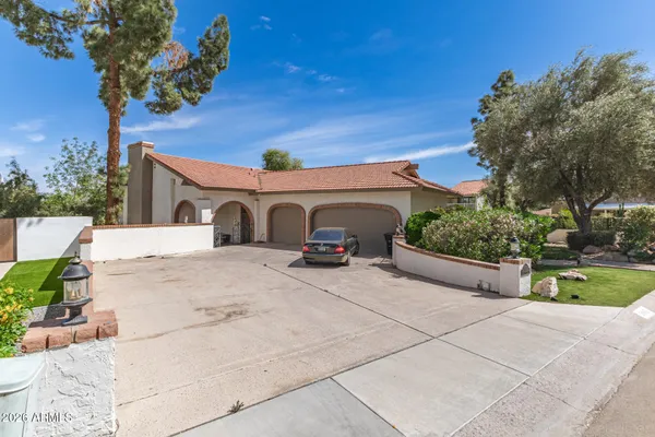 a living room with lots of furniture and a chandelier