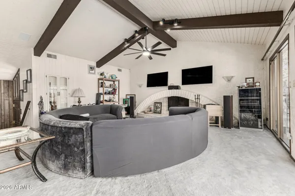 a kitchen with stainless steel appliances granite countertop a sink and white cabinets