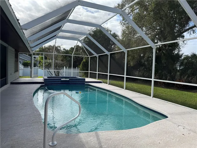 a view of a swimming pool with a porch