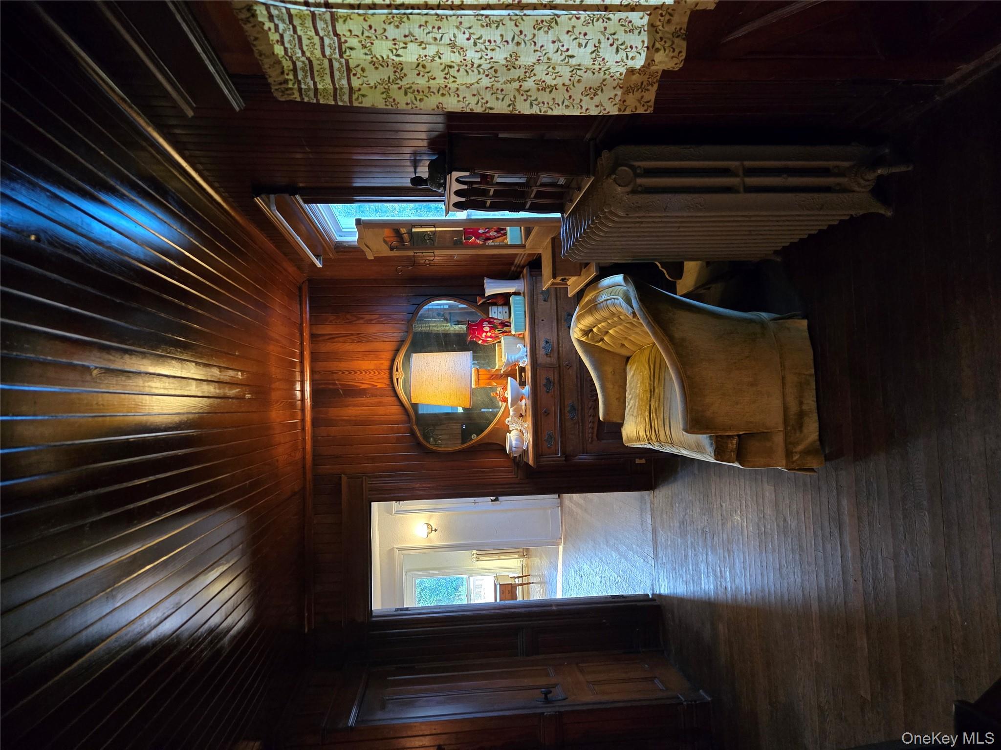 3953 Sound Avenue Riverhead, NY 11901 - Photo 12 of 14 a living room with furniture and a flat screen tv
