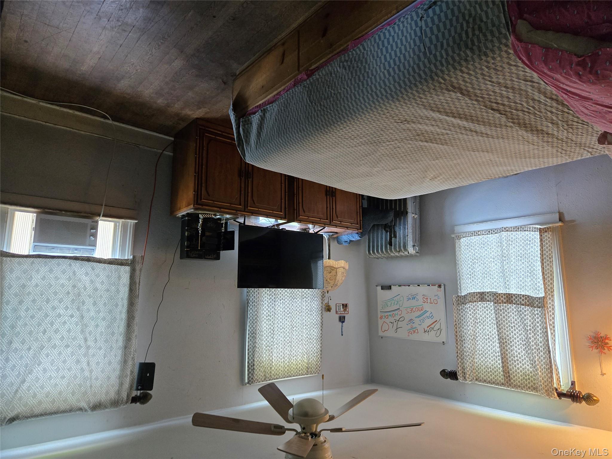 3953 Sound Avenue Riverhead, NY 11901 - Photo 13 of 14 a bedroom with a bed and a window