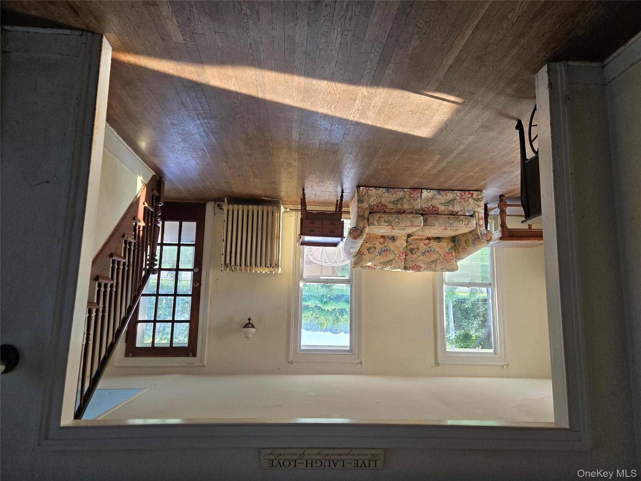3953 Sound Avenue Riverhead, NY 11901 - Photo 8 of 14 a living room with furniture and a large window