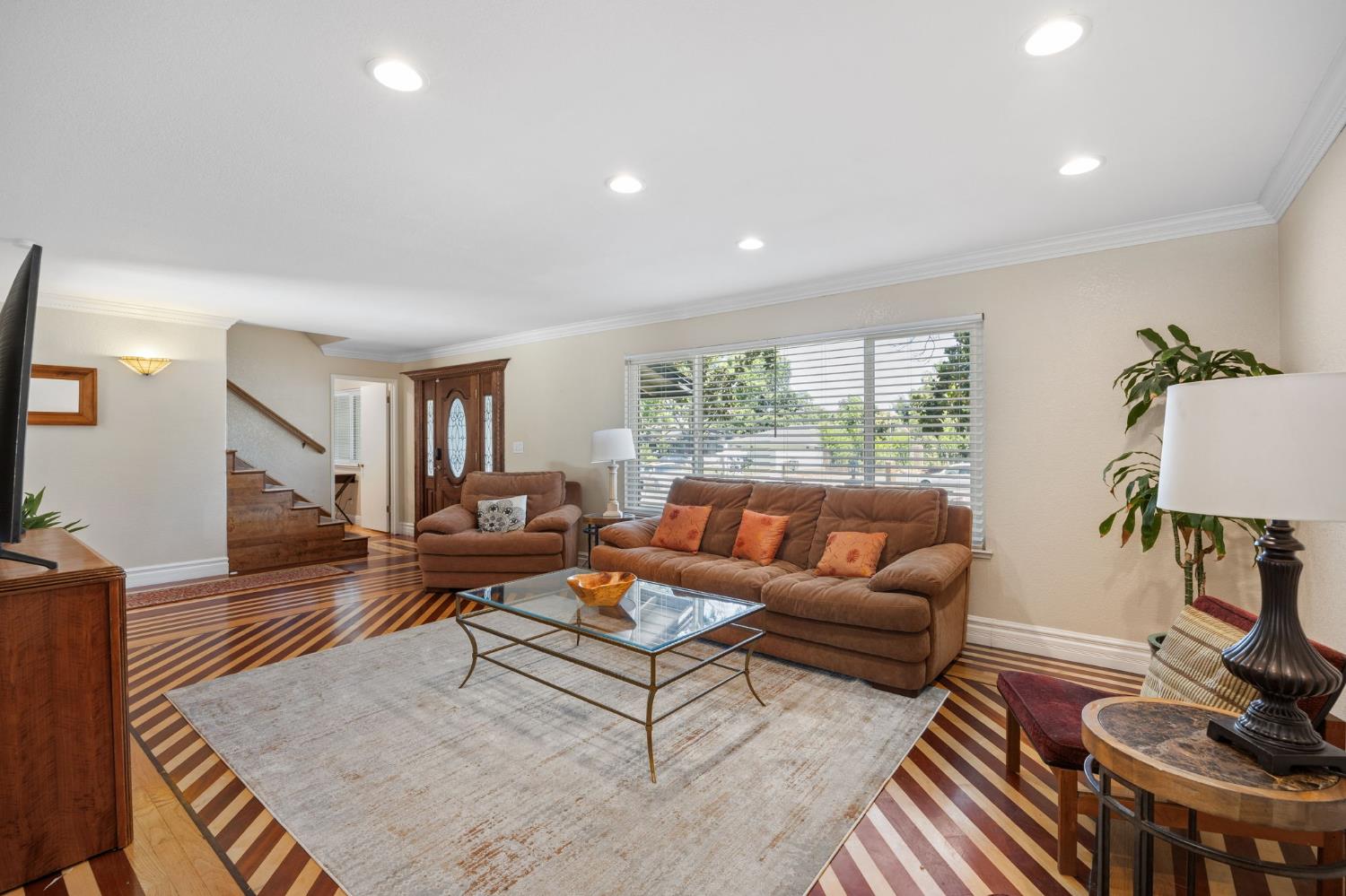 4206 Zephyr Way Sacramento, CA 95821 - Photo 9 of 45 a living room with furniture and a wooden floor