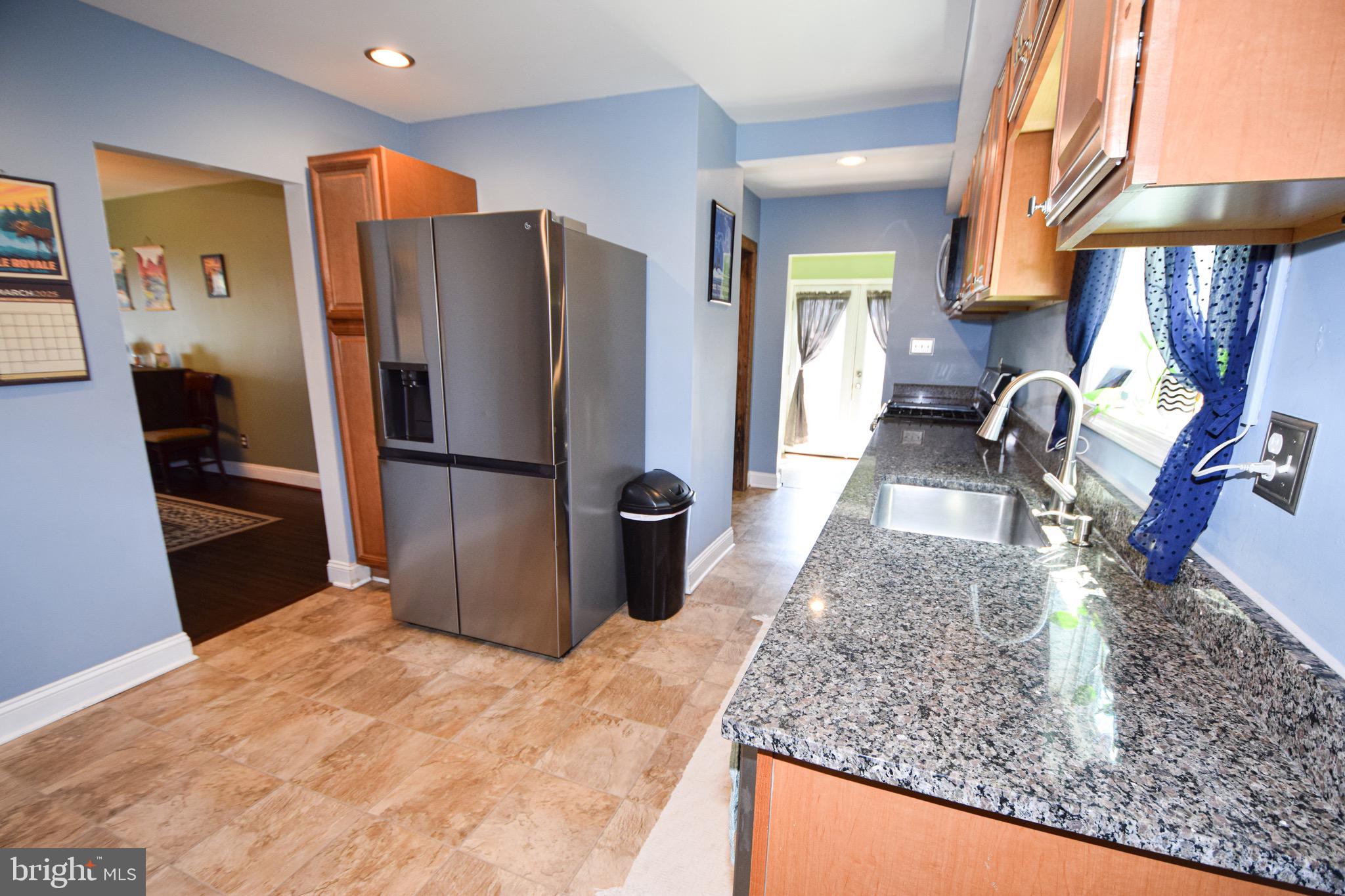 149 Post Road Aberdeen, MD 21001 - Photo 13 of 49 a kitchen with a refrigerator a stove and a sink