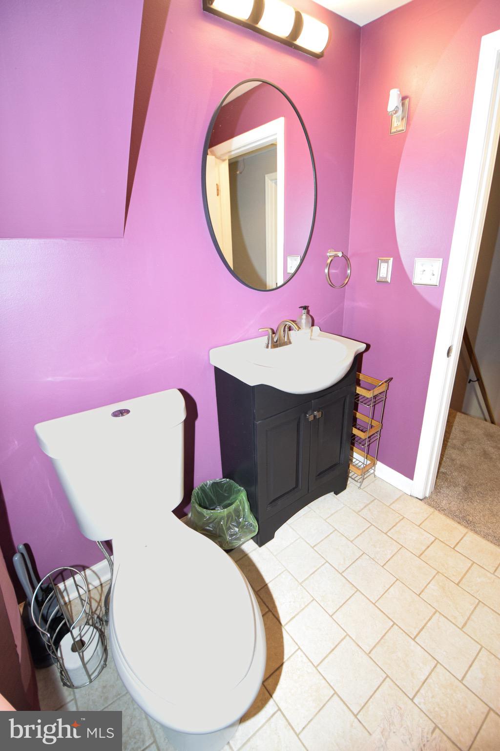 149 Post Road Aberdeen, MD 21001 - Photo 34 of 49 a bathroom with a sink mirror and vanity