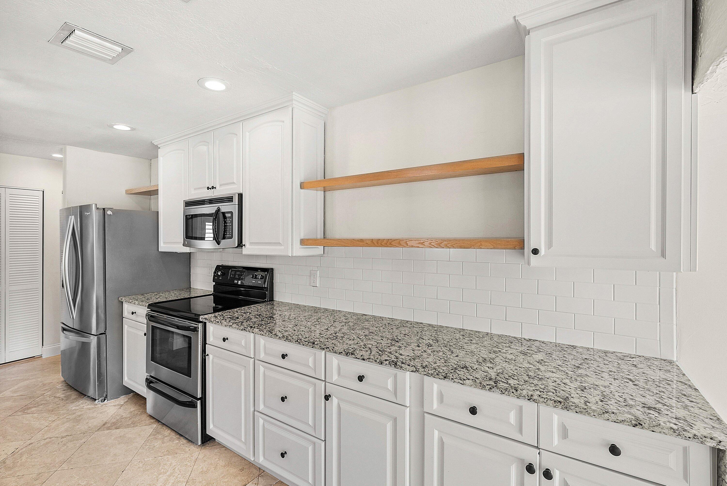 1508 Cormorant Road Delray Beach, FL 33444 - Photo 11 of 54 Kitchen w expansive counter & cabinets