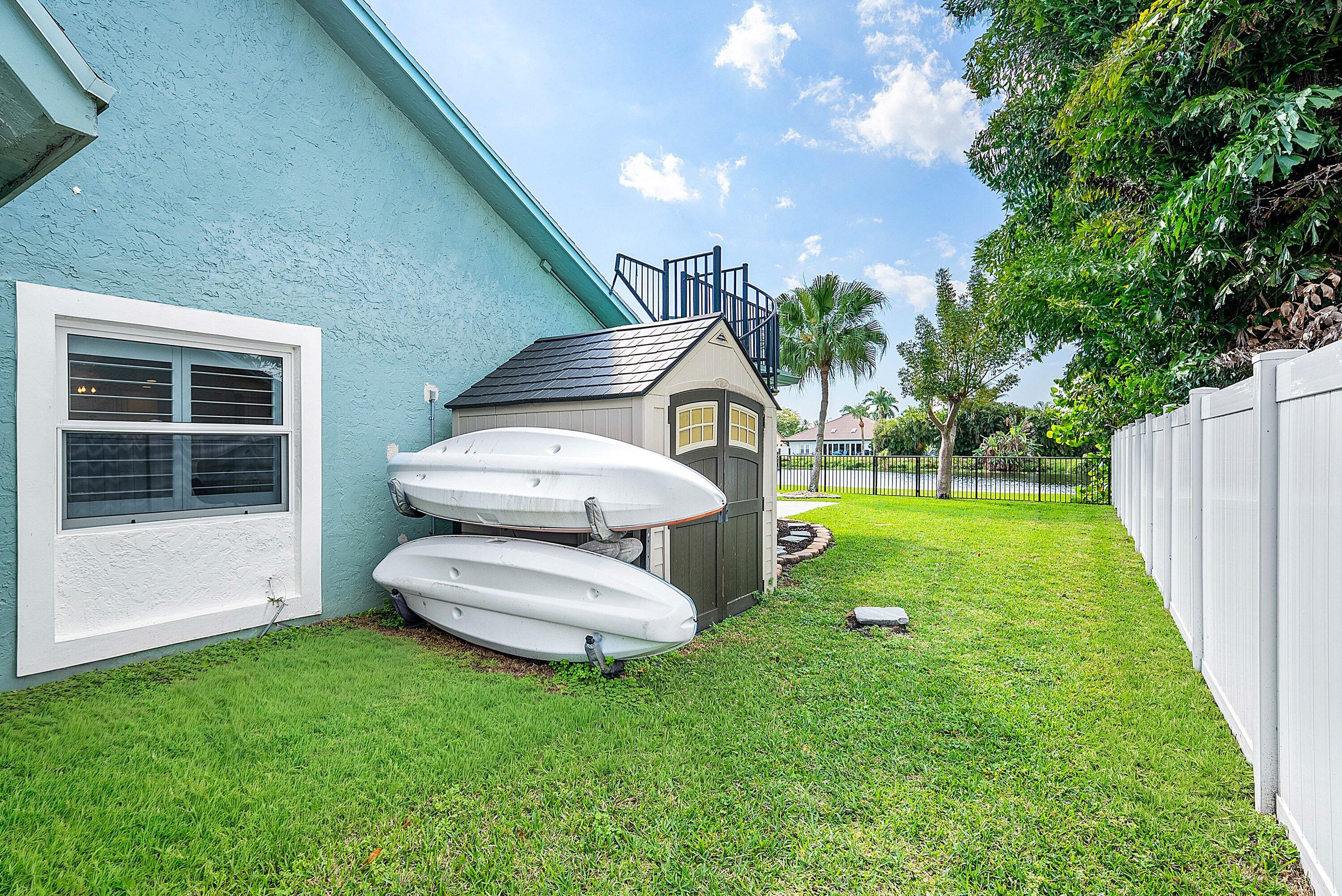 1508 Cormorant Road Delray Beach, FL 33444 - Photo 32 of 54 Shed & Kayaks