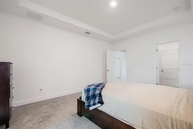 a bedroom with a bed and a table