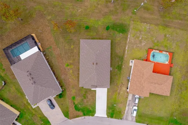 an aerial view of a house with swimming pool