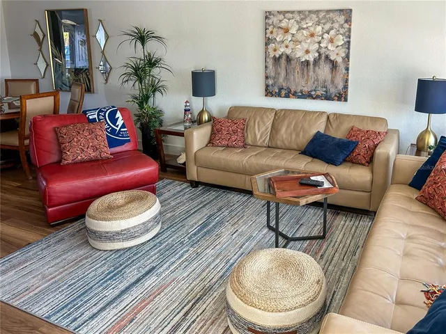 a living room with furniture and a rug