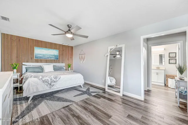 a spacious bathroom with a double vanity sink a mirror and a shower