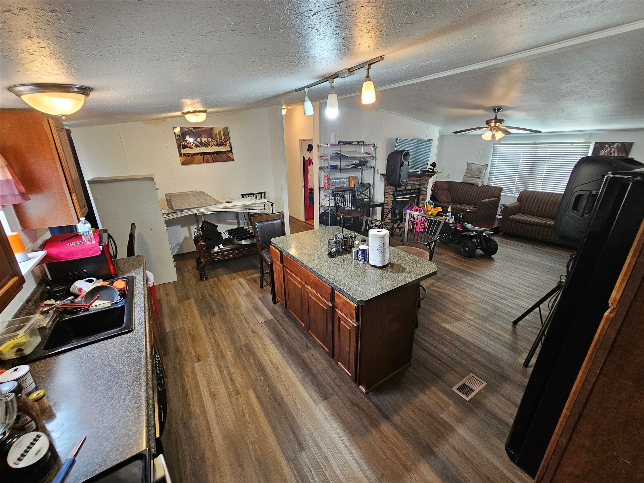 15519 Schank Road Conroe, TX 77306 - Photo 12 of 15 a living room with furniture and a wooden floor