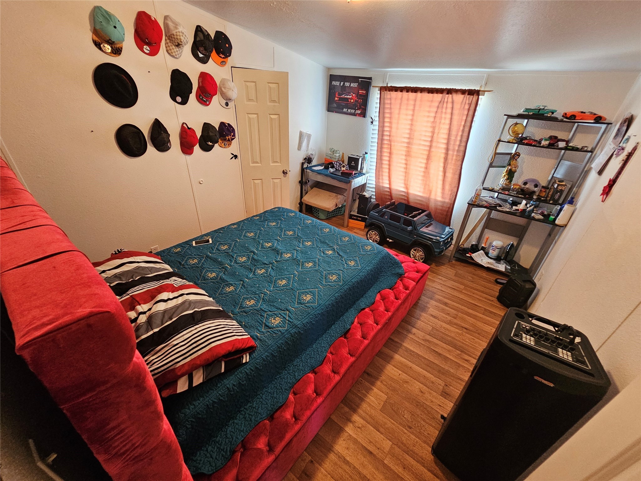 15519 Schank Road Conroe, TX 77306 - Photo 13 of 15 a bedroom with a bed and a walk in closet