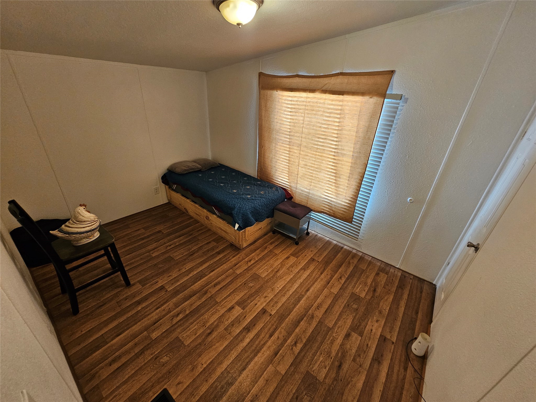 15519 Schank Road Conroe, TX 77306 - Photo 14 of 15 a living room with furniture rug and a window