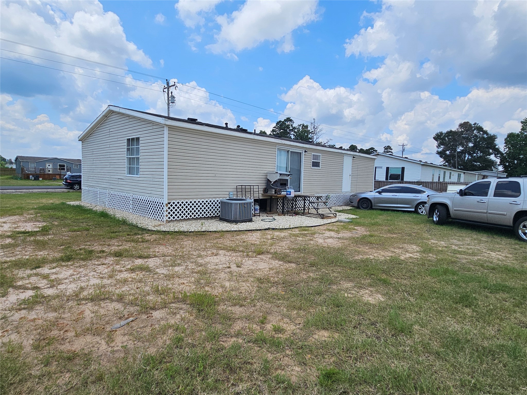 15519 Schank Road Conroe, TX 77306 - Photo 4 of 15 a view of a house with a patio