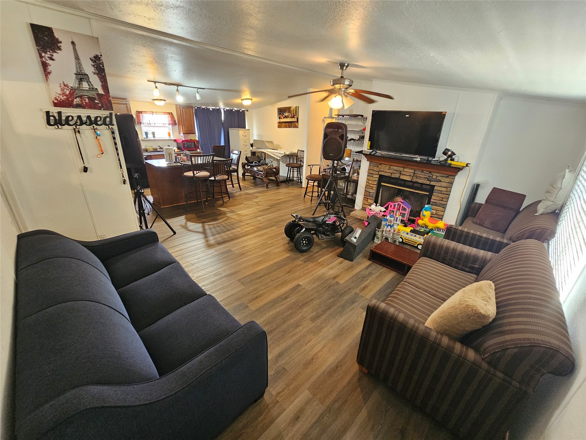 15519 Schank Road Conroe, TX 77306 - Photo 6 of 15 a living room with furniture and a flat screen tv