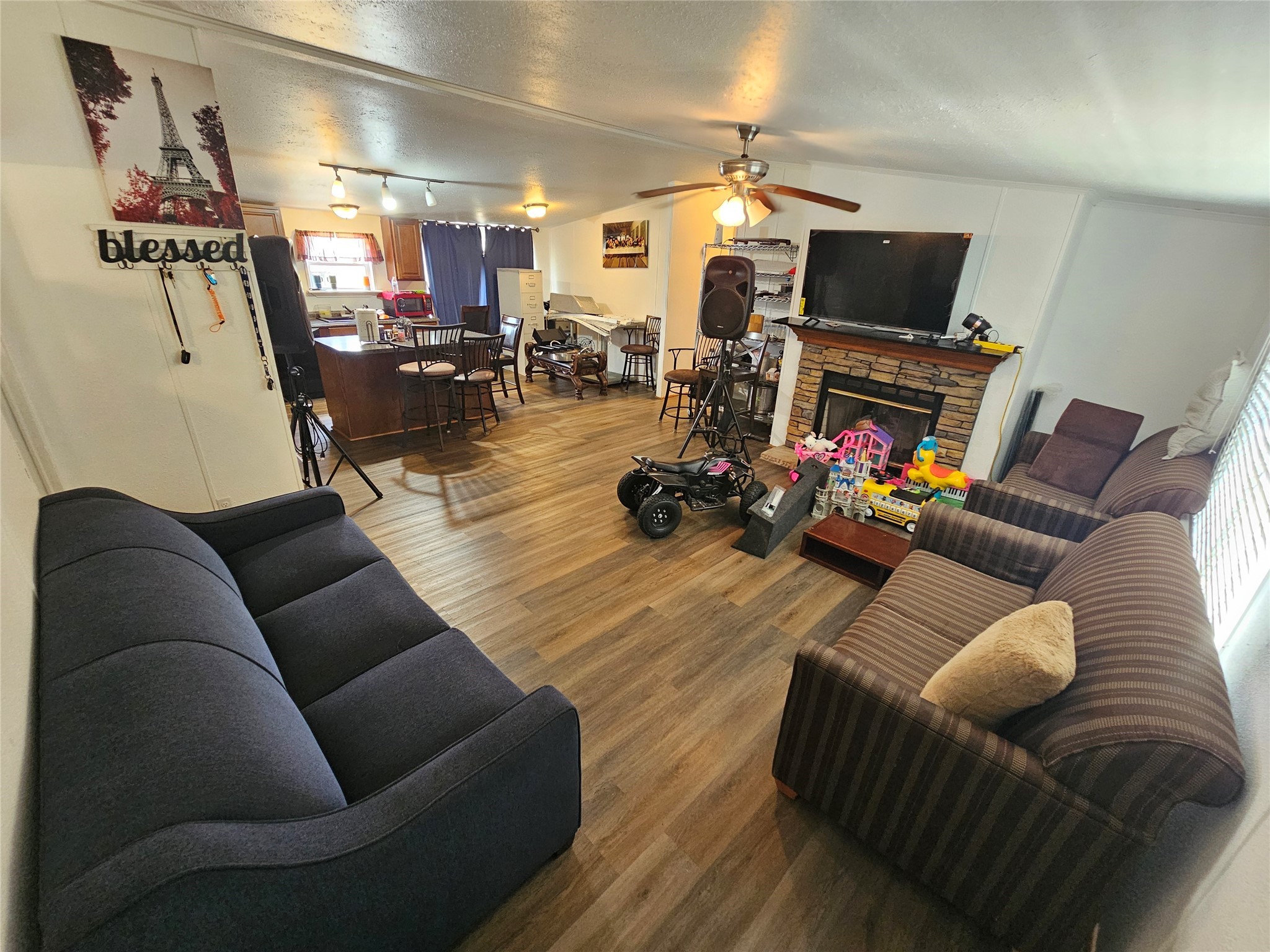 15519 Schank Road Conroe, TX 77306 - Photo 7 of 15 a living room with furniture and a flat screen tv