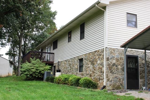 1309 Callaway Road Rocky Mount, VA 24151 - Photo 2 of 25 a view of a white house next to a yard
