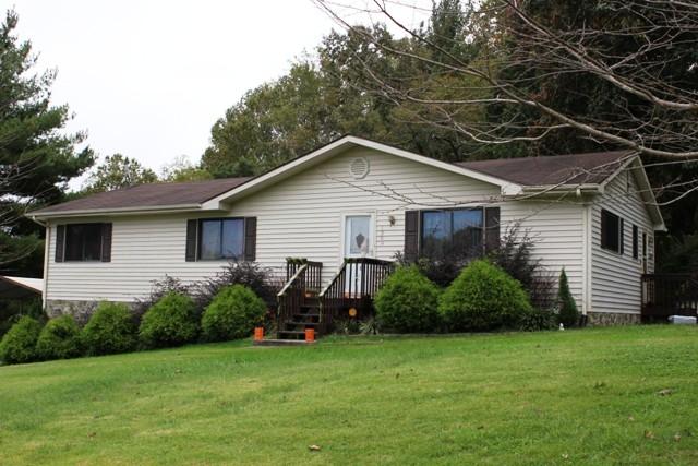 1309 Callaway Road Rocky Mount, VA 24151 - Photo 19 of 25 a view of a house with a yard and plants