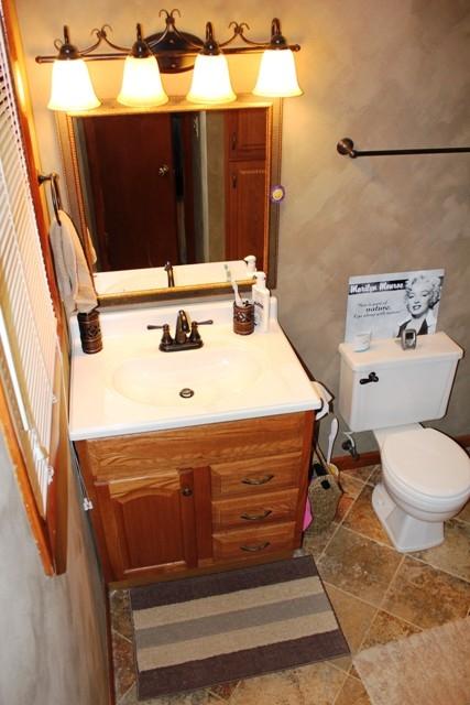 1309 Callaway Road Rocky Mount, VA 24151 - Photo 9 of 25 a bathroom with a sink and a mirror