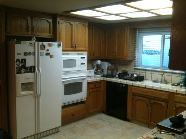 1664 Davis Street Ripon, CA 95366 - Photo 7 of 8 a kitchen with stainless steel appliances granite countertop a refrigerator and a sink