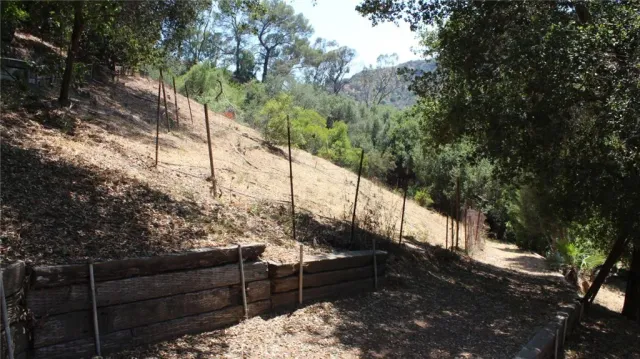 a view of white fence of a house