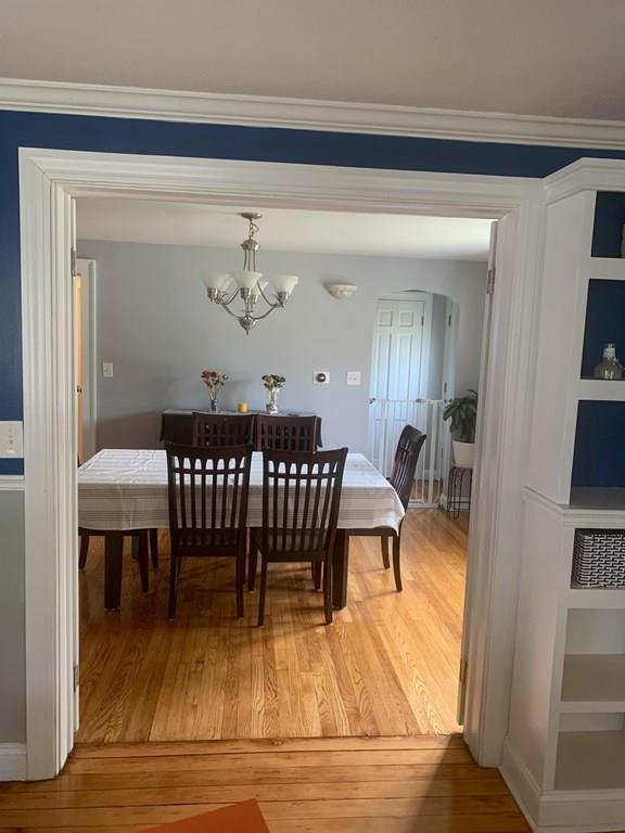 239 Windemere Street Springfield, MA 01104 - Photo 13 of 32 a dining room with furniture a rug and wooden floor