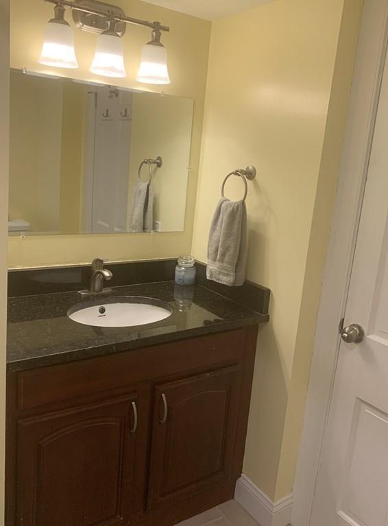 239 Windemere Street Springfield, MA 01104 - Photo 18 of 32 a bathroom with a sink and a mirror