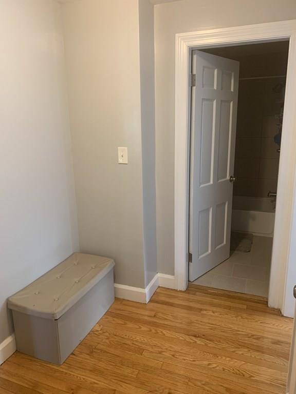 239 Windemere Street Springfield, MA 01104 - Photo 20 of 32 a view of a room with wooden floor and bathroom