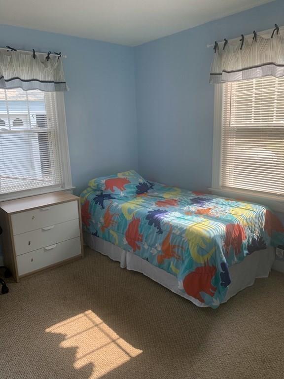 239 Windemere Street Springfield, MA 01104 - Photo 21 of 32 a bedroom with a bed and a window