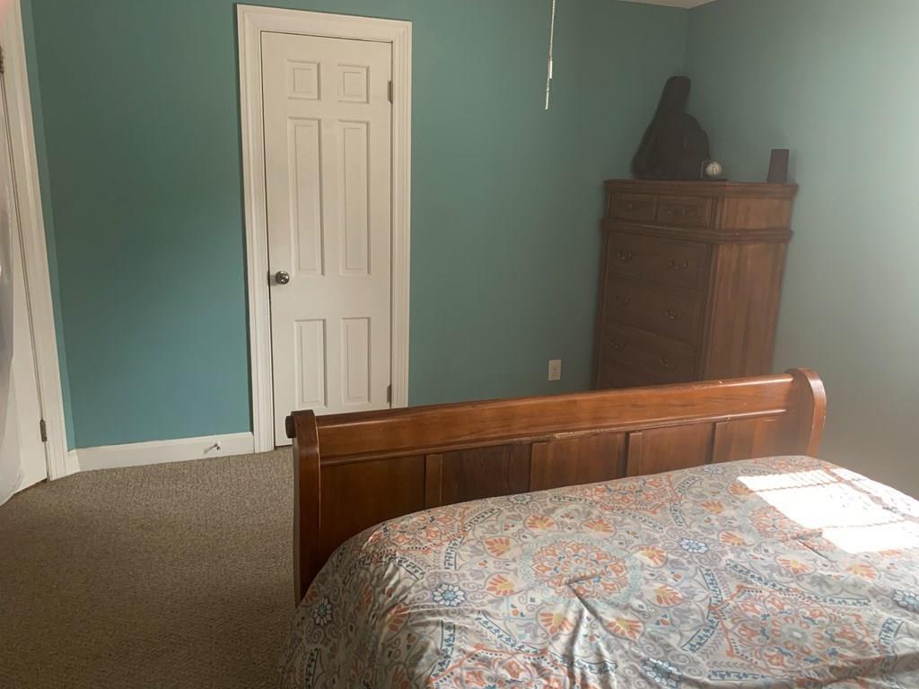 239 Windemere Street Springfield, MA 01104 - Photo 23 of 32 a bedroom with a bed and a window