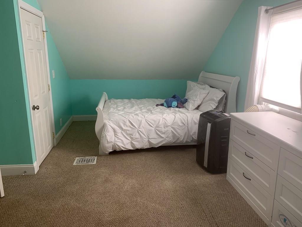 239 Windemere Street Springfield, MA 01104 - Photo 25 of 32 a bedroom with a bed and a window
