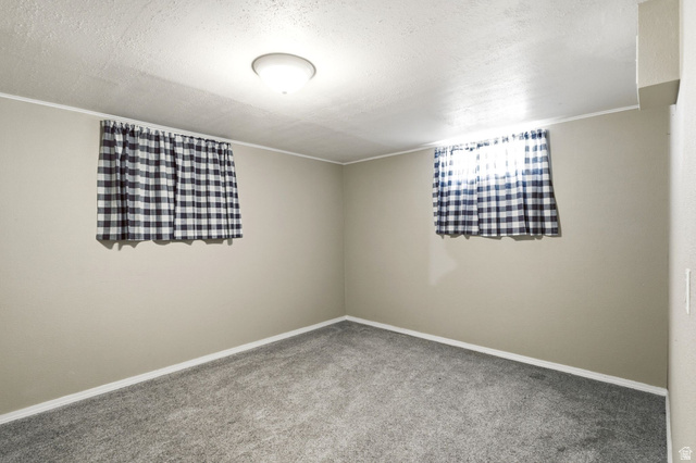 1925 South Main Street Bountiful, UT 84010 - Photo 26 of 48 Room featuring neutral-toned walls, grey carpeting, and white trim