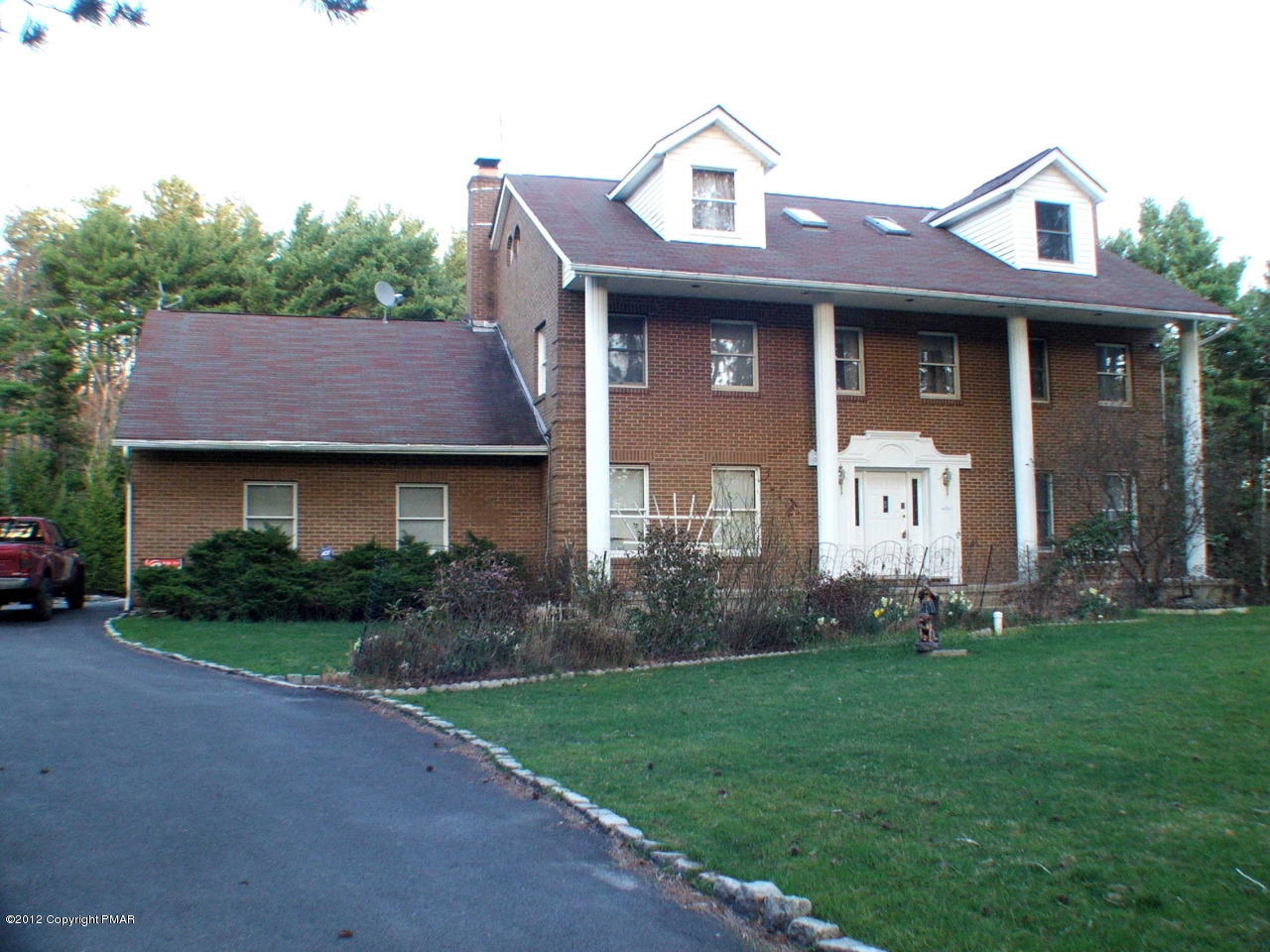 488 Rinker Road Stroudsburg, PA 18360 - Photo 1 of 54 a front view of a house with a garden and yard