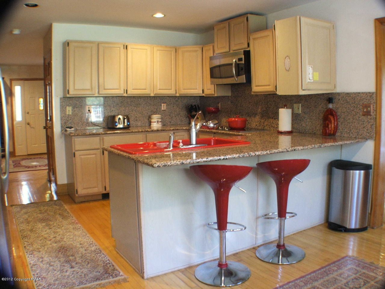 488 Rinker Road Stroudsburg, PA 18360 - Photo 13 of 54 a kitchen with stainless steel appliances granite countertop a sink and a refrigerator